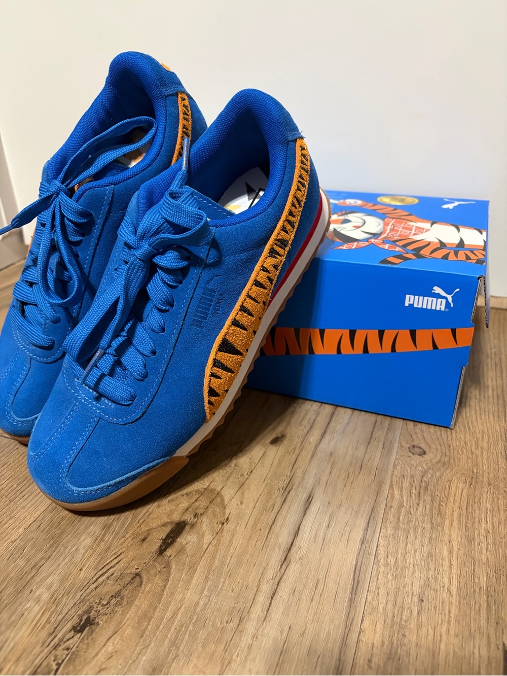 Puma x Frosted Flakes Blue Suede Sneakers with Orange Tiger Stripe Detail